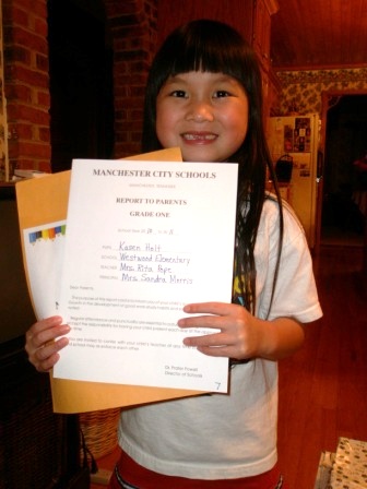 Kasen with her report card